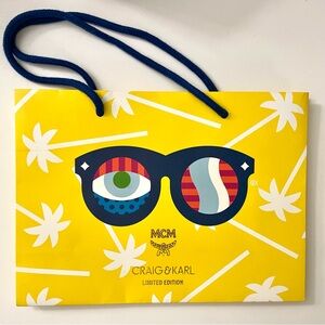 MCM Craig & Karl Limited Edition Paper Gift Bag Yellow Logo